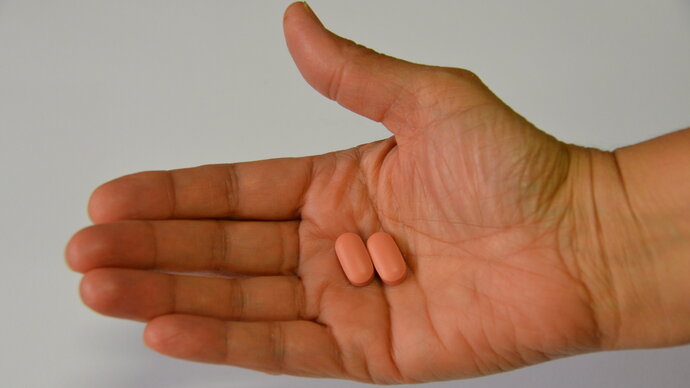 Single-dose tafenoquine 150mg tablets in palm of hand