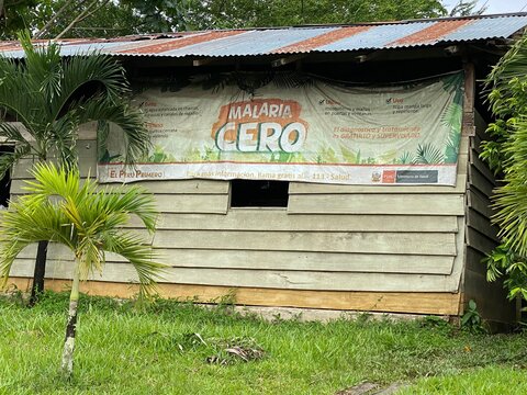 Malaria Zero campaign poster on side of building