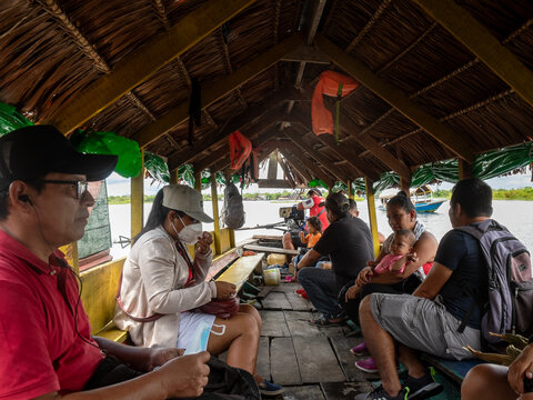 Healthworkers in a boat, Peru