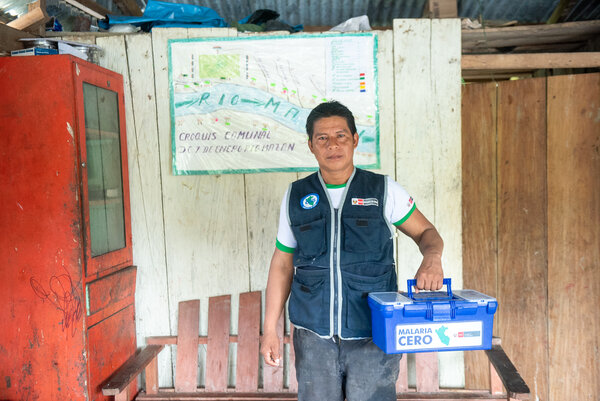 Health Practitioner Holding a box